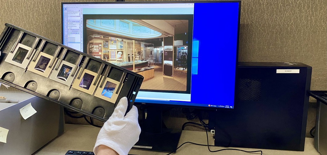 Photo scanning service technician carefully handling slides with gloves